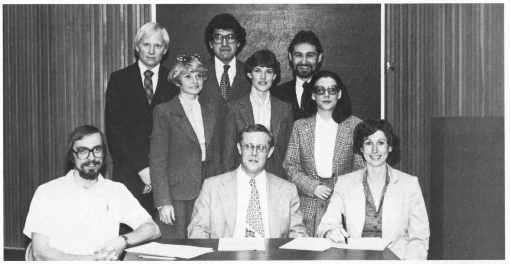 A black and white photograph of nine law faculty and students who qualified as finalists in a client counseling competition